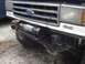 1989 Ford Bronco - Front view of a Ford truck with a winch installed. The grille and 4x4 badge are visible.