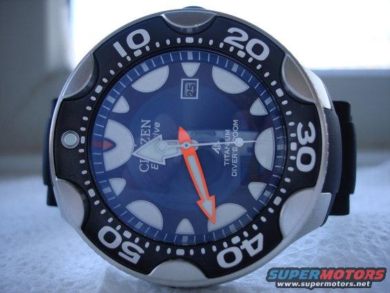 Blue Citizen Eco-Drive dive watch with orange hands and date window