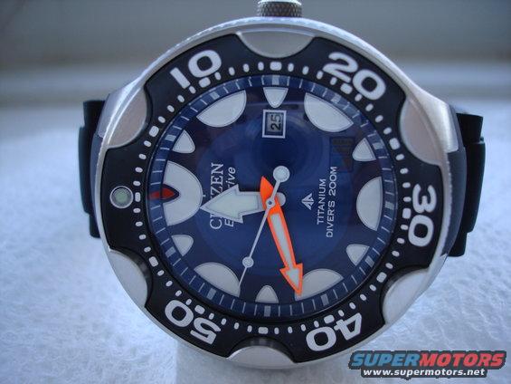 Citizen Eco-Drive Titanium Divers 200M watch face with blue dial and orange hands