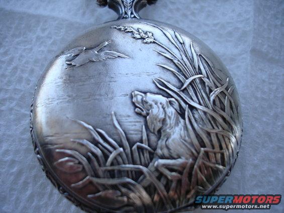silver pocket watch case with engraved hunting scene: dog in reeds, birds in sky