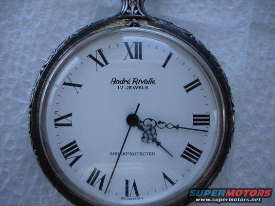 Pocket watch with Roman numerals and 'Andr&eacute; Rivalle' branding