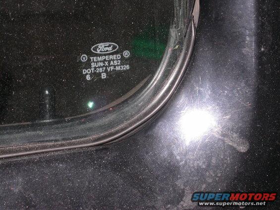 Close-up of Ford tempered glass with markings
