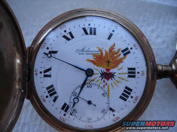 Pocket watch with sacred heart illustration and 'Admiral Non Magnetic' text