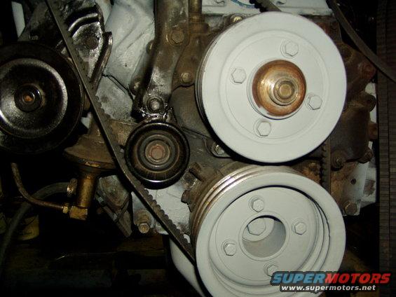 This is a Alternator Belt tensioner I added to help 'stabilize' the belt from flapping.
 Idler came from a '98 Ford Contour and was custom fabricated.