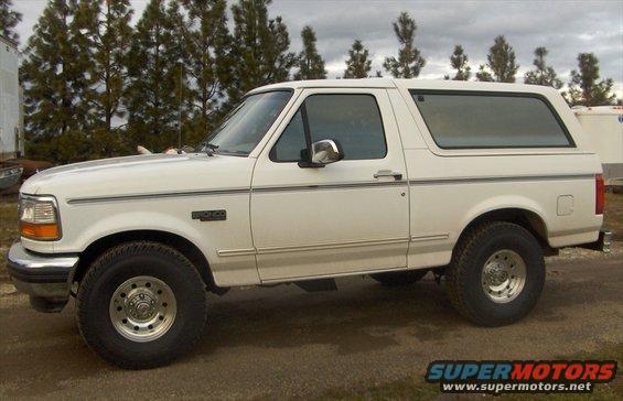 New 33x12.50 tires, on stock suspension. I also removed the running boards and the hood mounted wind deflector.