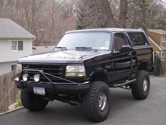 Black 1995 Ford Bronco with bull bar and large tires