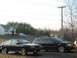 2002 Volkswagen Passat - A black wagon, identified as a 2002 Volkswagen Passat, is parked next to another vehicle.
