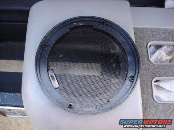 radio62.jpg Here is the back side of the new grill. it normally screws to the speaker and sandwhiches the door.