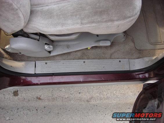 radio71.jpg ok-another break in the rain. now to run the door speaker wires.
this is the door sill and 3 screws the trim is out.