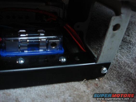 radio82.jpg i bolted the mount to the seat. i used some lock washers to hold it tight.