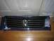 1987 Volkswagen Scirocco - Volkswagen grille part shown on a blue box with Supermotors.net logo visible.