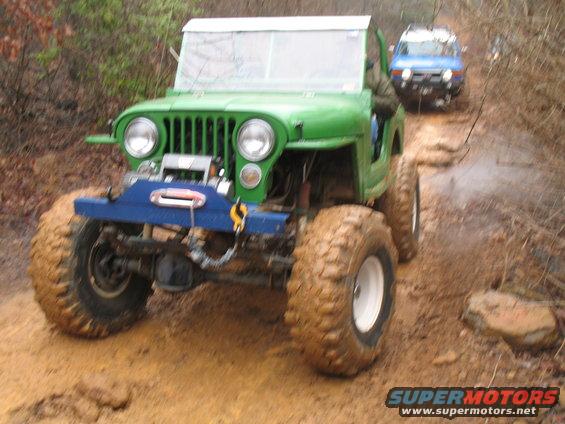Custom 4 link, what looked like a 350, rear air shocks, etc.