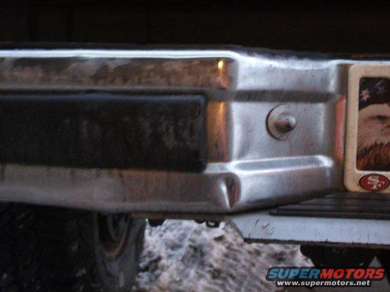 1991 Ford Bronco rear bumper with dent and eagle sticker
