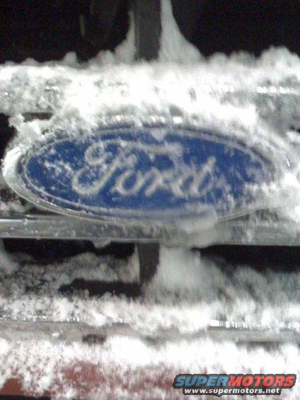 Ford emblem on a snow-covered grille