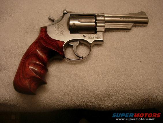 Revolver with polished wooden grips and stainless steel frame