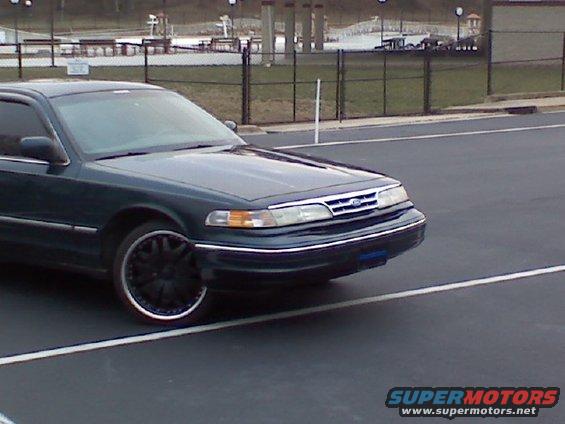 Police tag and strobes behind grill