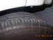 1995 Ford Taurus - A close-up view of a tire and the lower body panel of a vehicle, with a timestamp visible in the corner.