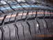 1995 Ford Taurus - A close-up view of a tire's tread pattern, showing the grooves and sipes, with colored indicator lines.