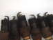 1996 Ford Bronco - A row of used spark plugs shows signs of wear and tear.