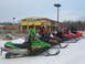 1995 Ford Bronco - Several snowmobiles are parked in the snow outside a McDonald's restaurant.