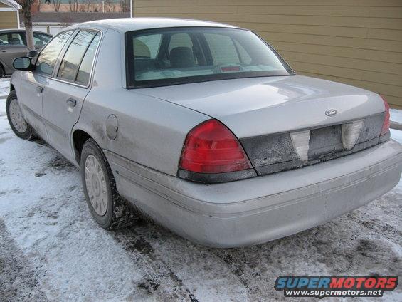 Rear view of a silver 2004 Ford Crown Victoria in snow
