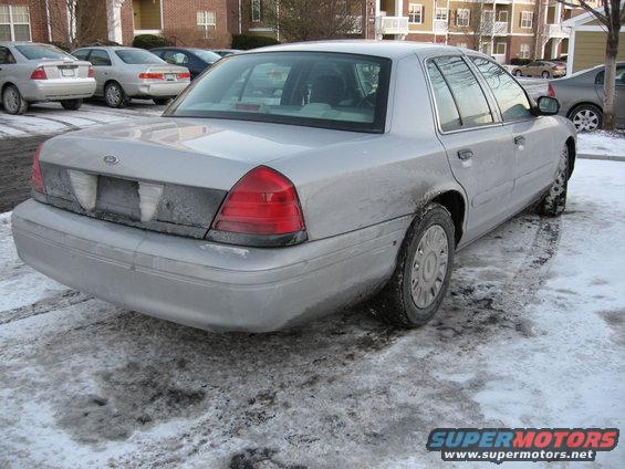 2004 Ford Crown Victoria parked in snow, rear view