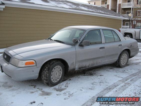 Silver 2004 Ford Crown Victoria sedan in snow