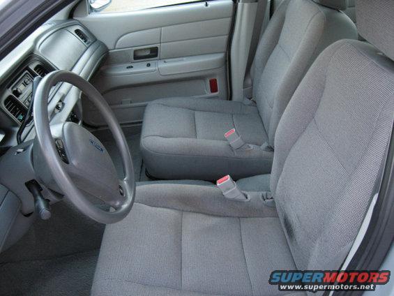 2004 Ford Crown Victoria interior showing front seats, steering wheel, and dashboard