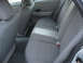 2004 Ford Crown Victoria - The interior of the vehicle shows the rear seats and door panel with gray fabric upholstery.