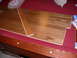 1988 Ford Bronco - Wood flooring planks are shown on a red surface, possibly a pool table, with some packaging nearby.