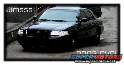 Black Ford Crown Victoria, front 3/4 view, appears to be a 2002 model