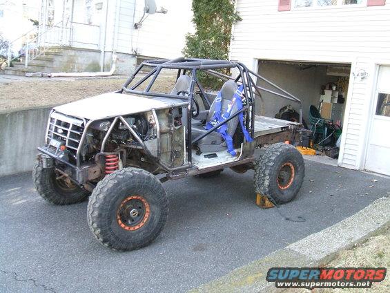 1995 Ford Bronco modified into a custom off-road buggy with a roll cage and large tires