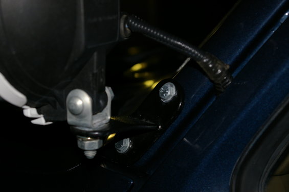 Pillar light mount on dark blue vehicle body