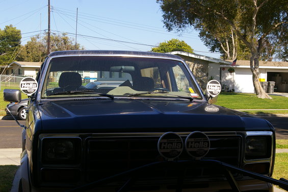 Dark blue Ford Bronco with Hella fog lights and side mirrors