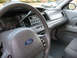 2004 Ford Crown Victoria - Interior view of a gray 2004 Ford Crown Victoria, highlighting the dashboard and steering wheel.