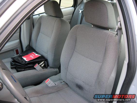 Interior view of a 2004 Ford Crown Victoria showing front seats and dashboard