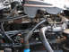 2004 Ford Crown Victoria - Close-up view of engine components, including hoses and electrical wiring.