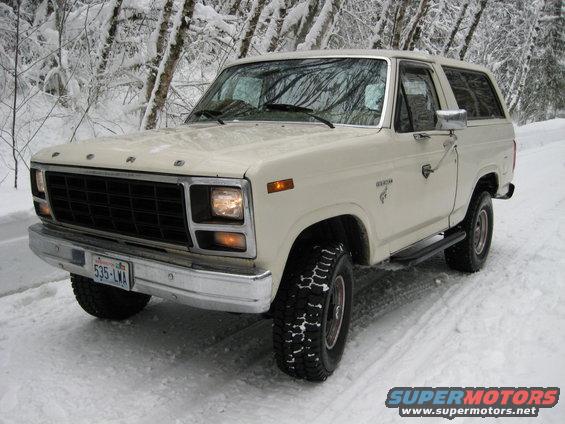 White 1980 Ford Bronco in snow, 3/4 front view