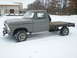 1979 Ford F-150 - This 1979 Ford F-150 flatbed truck is parked in a snowy outdoor setting.
