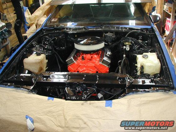 1988 Chevrolet Camaro engine bay with orange V8 engine