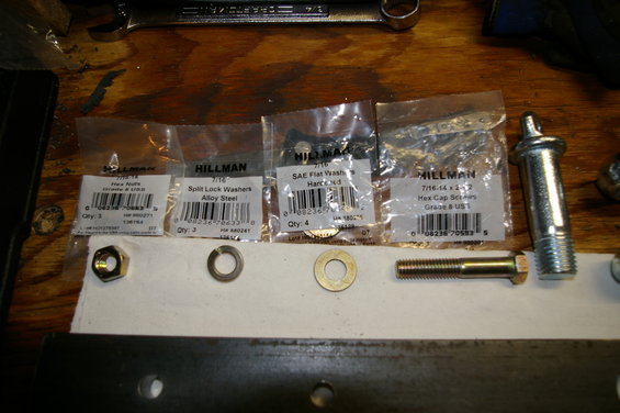 Hex nuts, split lock washers, SAE flat washers, and hex cap screws