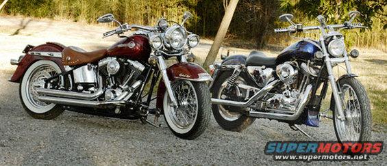 Two motorcycles parked on gravel, one red with a brown seat, the other blue