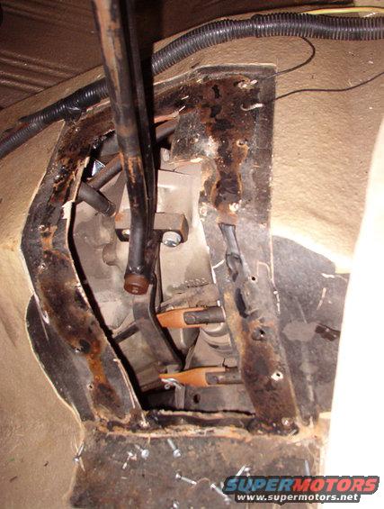 01shifter.jpg Half the reason for rebuilding the t-case is that we can't get the shifter to move into 4H.  When we had the body completely blasted, repaired, painted, & Rhino-Lined, the tunnel was completely closed up so the shifter hole could be cut precisely.  But the guy in Baton Rouge who did some (crappy) work on the truck butchered it out worse than it was before.
