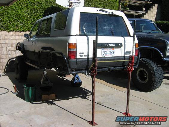 1985 Toyota 4Runner rear view on jacks with another vehicle to the right