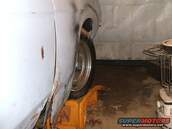 1969 Ford Torino fender and wheel on jack stand