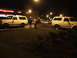 1990 Ford Bronco - Two white 1990 Ford Broncos are parked at night in front of a Walgreens store.