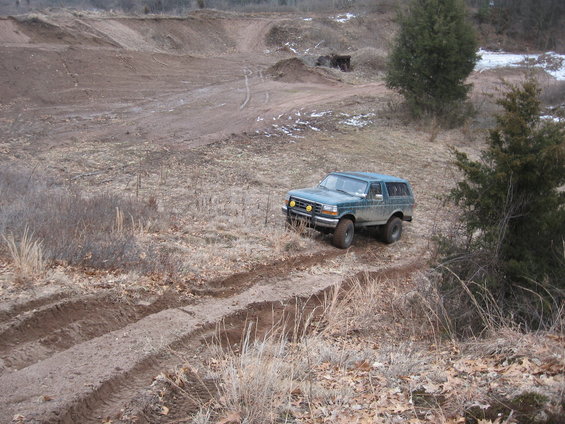Teal 1996 Ford Bronco on dirt road