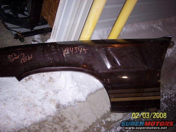 Dark brown car fender with gold stripes and handwritten text '82 camaro 1980 A4345'