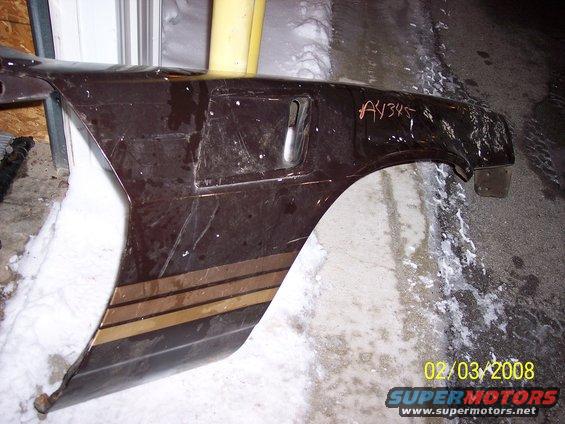 Dark brown car fender with gold and brown stripes, marked "A4345"