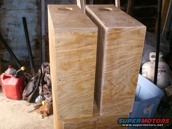 Two unfinished wooden boxes with holes on top